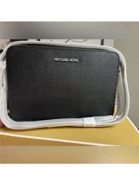 Michael Kors black crossbody bag
Brand